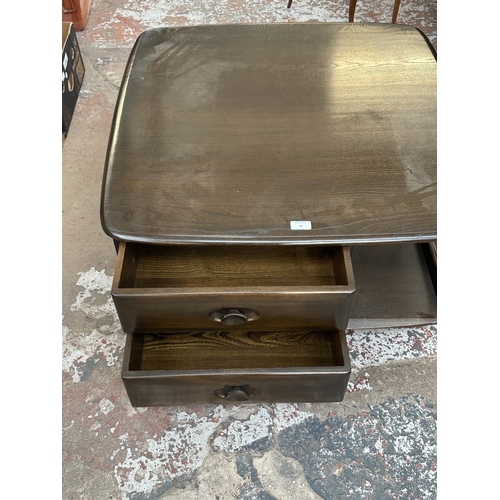18 - An Ercol elm Pandora coffee table - approx. 40cm high x 79cm wide x 79cm deep
