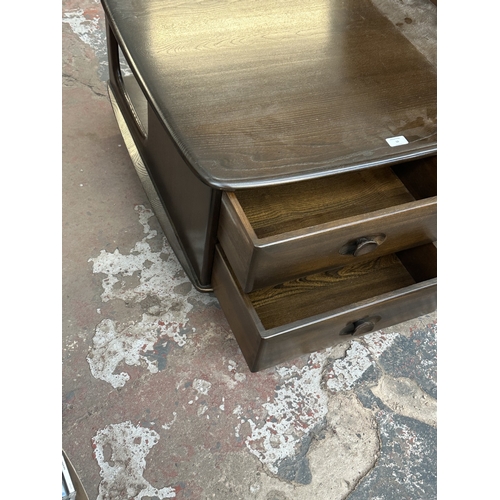 18 - An Ercol elm Pandora coffee table - approx. 40cm high x 79cm wide x 79cm deep