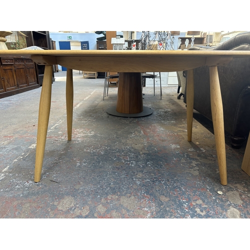 24 - A modern Ercol style ash plank dining table - approx. 75cm high x 77cm wide x 150cm long