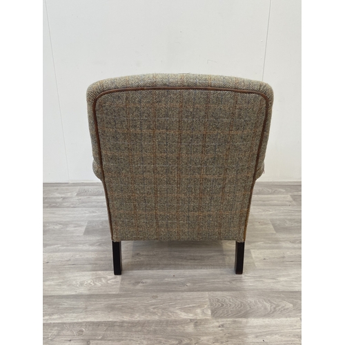 29 - A Tetrad Harris Tweed 100% pure new wool hand woven cloth armchair on beech supports and brass casto... 