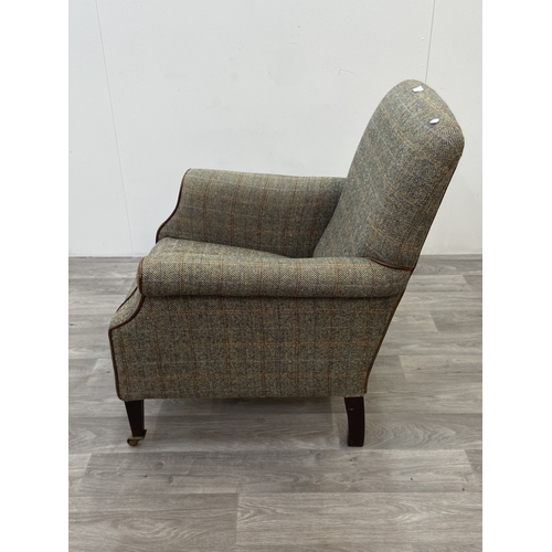 29 - A Tetrad Harris Tweed 100% pure new wool hand woven cloth armchair on beech supports and brass casto... 
