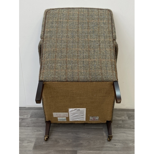 29 - A Tetrad Harris Tweed 100% pure new wool hand woven cloth armchair on beech supports and brass casto... 