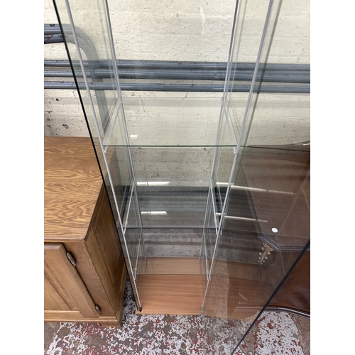 3 - A modern beech effect and glass display cabinet with three glass shelves - approx. 163cm high x 42.5... 