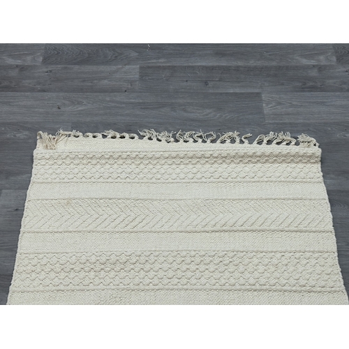 38 - Five Walton & Co 100% recycled PET yarn items, one throw - approx. 127cm x 152cm and four rugs, thre... 