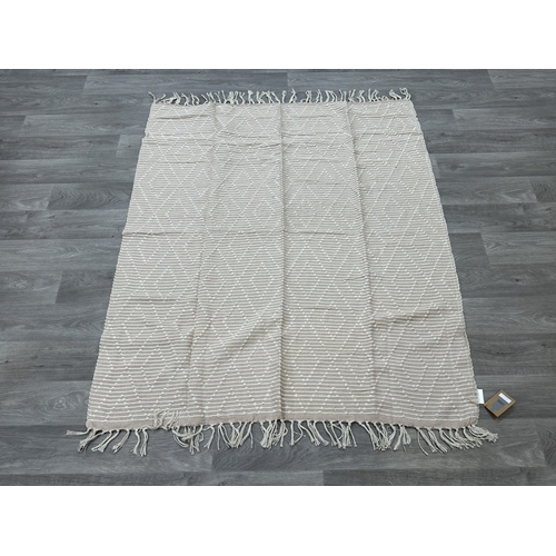 38 - Five Walton & Co 100% recycled PET yarn items, one throw - approx. 127cm x 152cm and four rugs, thre... 