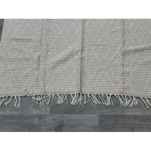 38 - Five Walton & Co 100% recycled PET yarn items, one throw - approx. 127cm x 152cm and four rugs, thre... 