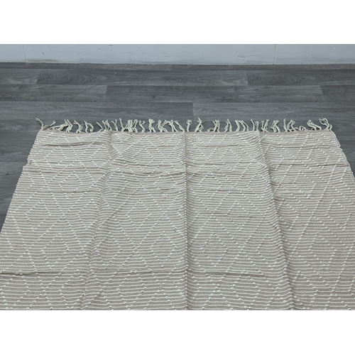 38 - Five Walton & Co 100% recycled PET yarn items, one throw - approx. 127cm x 152cm and four rugs, thre... 