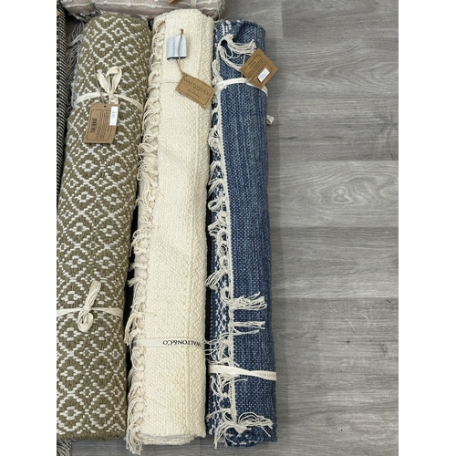 38 - Five Walton & Co 100% recycled PET yarn items, one throw - approx. 127cm x 152cm and four rugs, thre... 