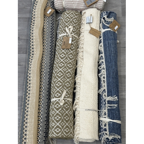 38 - Five Walton & Co 100% recycled PET yarn items, one throw - approx. 127cm x 152cm and four rugs, thre... 