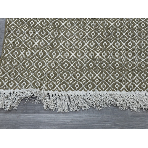 38 - Five Walton & Co 100% recycled PET yarn items, one throw - approx. 127cm x 152cm and four rugs, thre... 