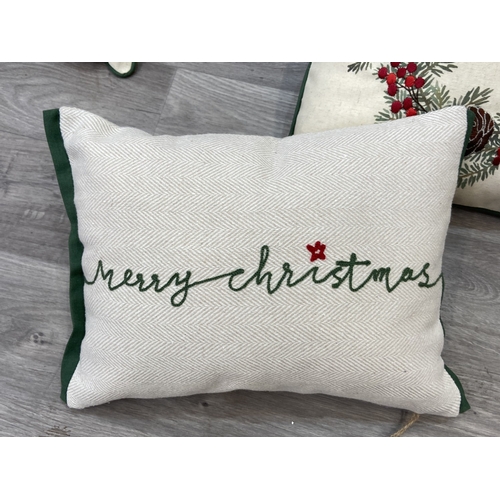 40 - Nine Walton & Co. Christmas themed fabric cushions, eight approx. 43cm x 43cm and one approx. 30cm x... 