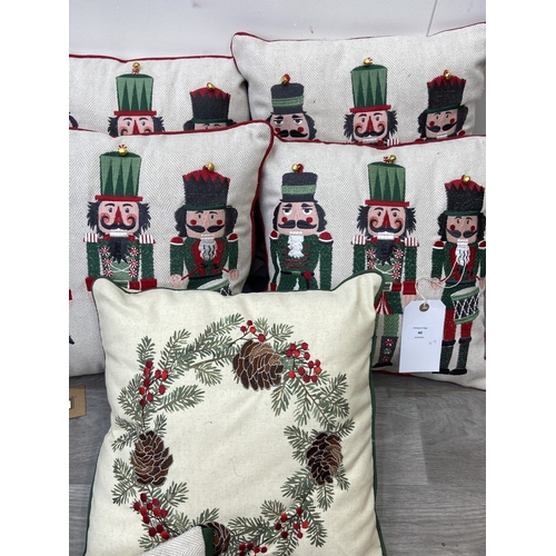 40 - Nine Walton & Co. Christmas themed fabric cushions, eight approx. 43cm x 43cm and one approx. 30cm x... 
