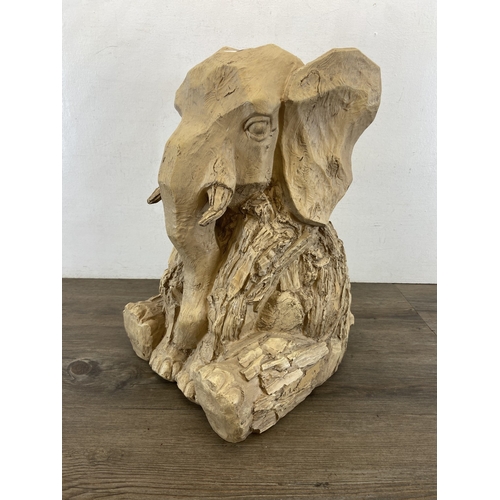 47 - A modern resin driftwood effect elephant statue - approx. 47cm high