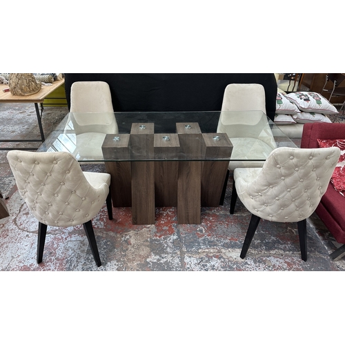 48 - A Harveys walnut effect and glass top Piston dining table and four beige buttoned fabric upholstered... 