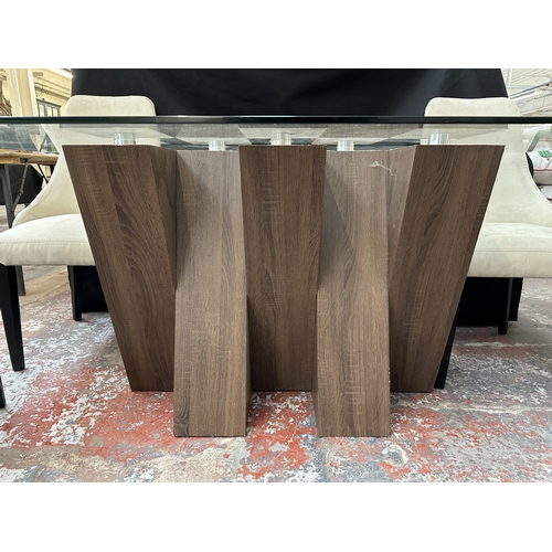 48 - A Harveys walnut effect and glass top Piston dining table and four beige buttoned fabric upholstered... 