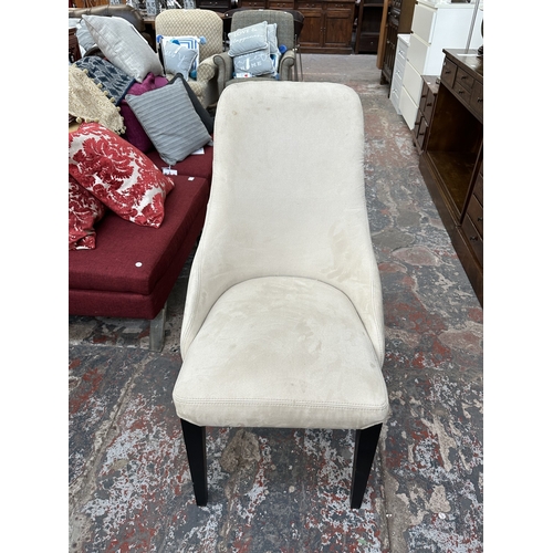 48 - A Harveys walnut effect and glass top Piston dining table and four beige buttoned fabric upholstered... 