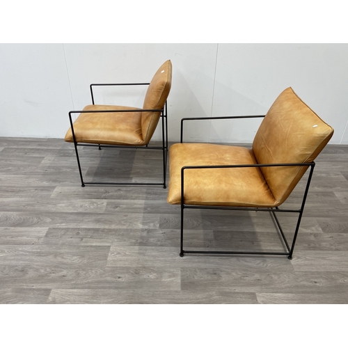 50 - A pair of Nkuku Durium style aged tan leather and iron lounger armchairs - approx. 80cm high x 59cm ... 