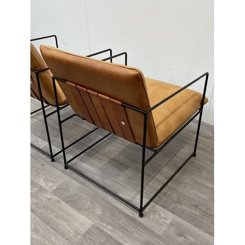 50 - A pair of Nkuku Durium style aged tan leather and iron lounger armchairs - approx. 80cm high x 59cm ... 