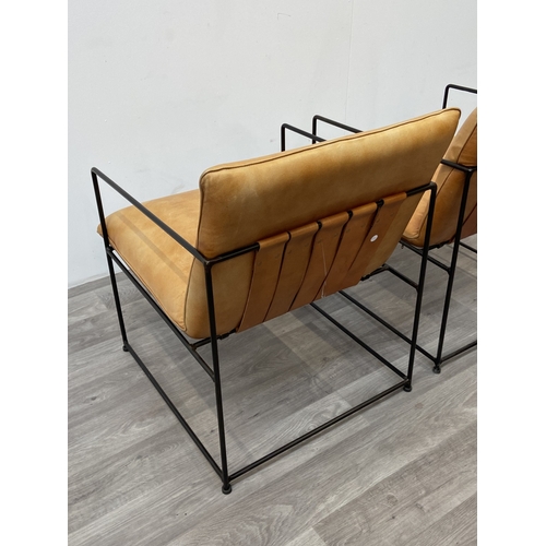 50 - A pair of Nkuku Durium style aged tan leather and iron lounger armchairs - approx. 80cm high x 59cm ... 