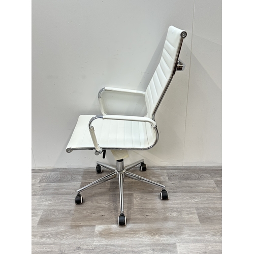 53 - A modern white leatherette and chrome plated swivel desk chair - approx. 109cm high x 56cm wide x 54... 