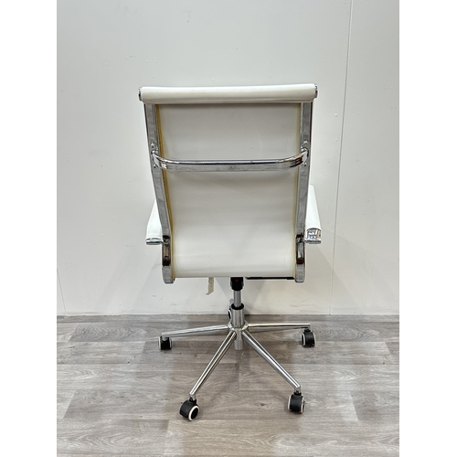 53 - A modern white leatherette and chrome plated swivel desk chair - approx. 109cm high x 56cm wide x 54... 