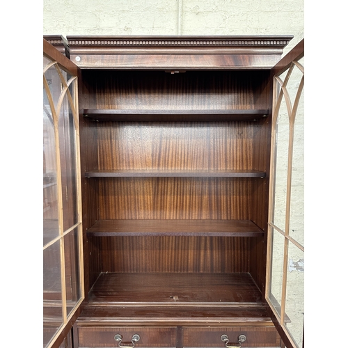 7 - A Georgian style mahogany glazed three section bookcase - approx. 205cm high x 278cm wide x 38cm dee... 