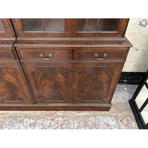 7 - A Georgian style mahogany glazed three section bookcase - approx. 205cm high x 278cm wide x 38cm dee... 
