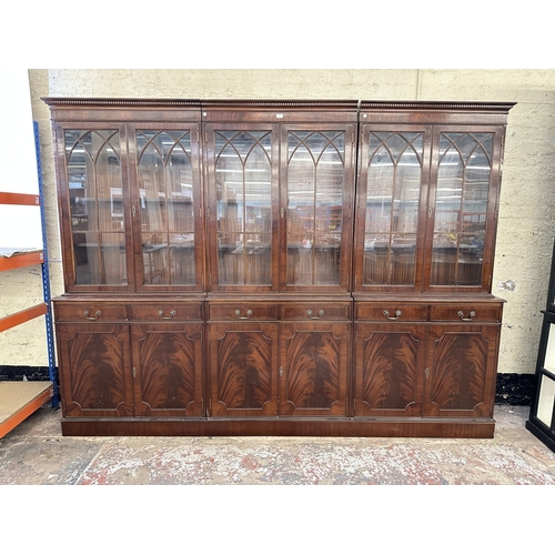 7 - A Georgian style mahogany glazed three section bookcase - approx. 205cm high x 278cm wide x 38cm dee... 