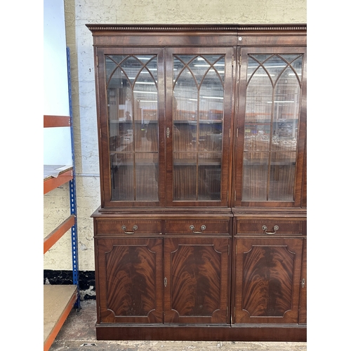 7 - A Georgian style mahogany glazed three section bookcase - approx. 205cm high x 278cm wide x 38cm dee... 