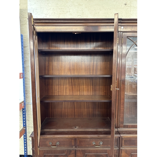 7 - A Georgian style mahogany glazed three section bookcase - approx. 205cm high x 278cm wide x 38cm dee... 