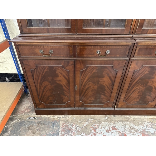 7 - A Georgian style mahogany glazed three section bookcase - approx. 205cm high x 278cm wide x 38cm dee... 