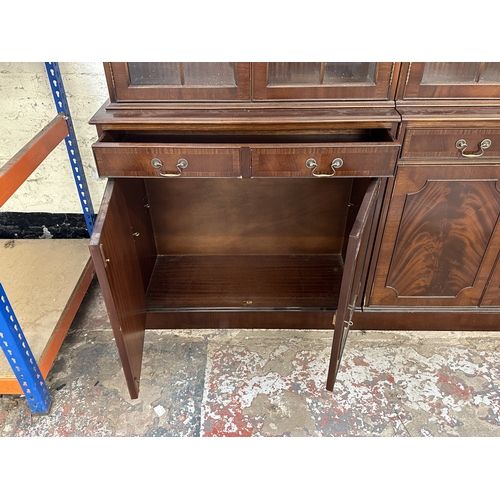 7 - A Georgian style mahogany glazed three section bookcase - approx. 205cm high x 278cm wide x 38cm dee... 