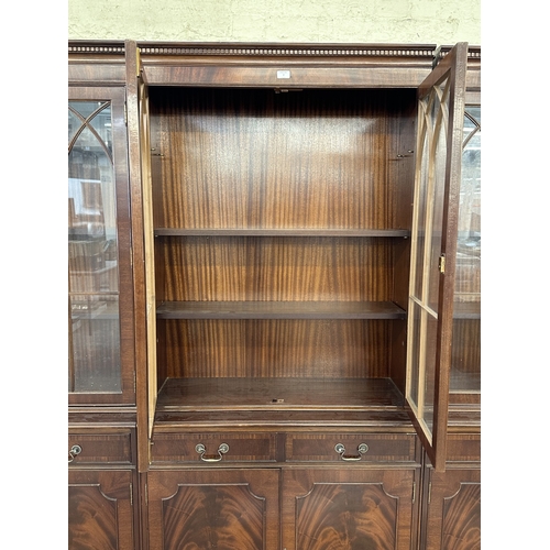 7 - A Georgian style mahogany glazed three section bookcase - approx. 205cm high x 278cm wide x 38cm dee... 
