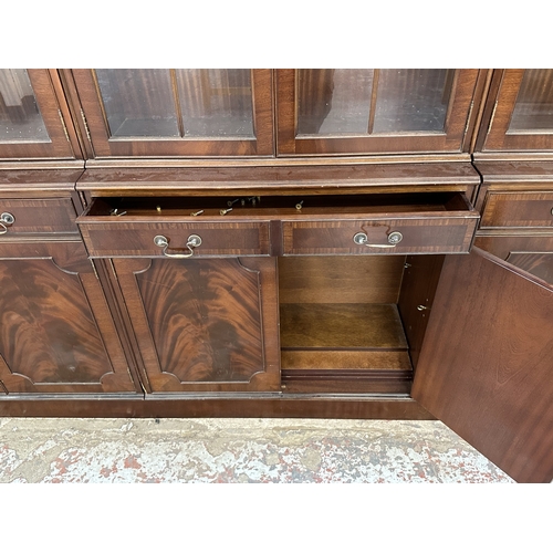 7 - A Georgian style mahogany glazed three section bookcase - approx. 205cm high x 278cm wide x 38cm dee... 
