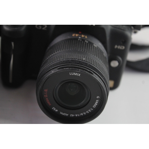 104 - Two digital cameras, one Panasonic Lumix DMC-G2 12.1mp mirrorless fitted with G Vario 1:3.5-5.6 14-4... 