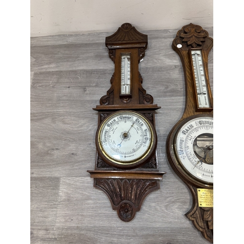 Four early 20th century carved oak cased aneroid barometers - largest ...