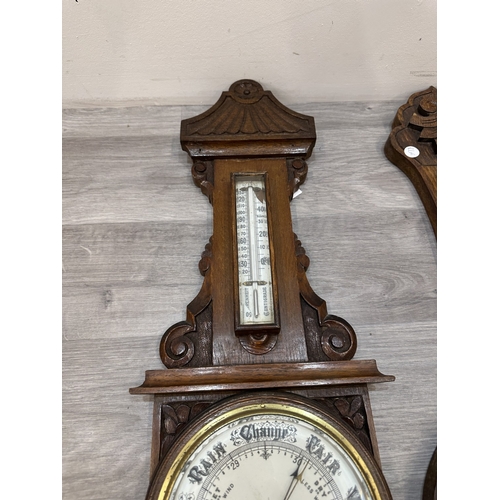 Four early 20th century carved oak cased aneroid barometers - largest ...