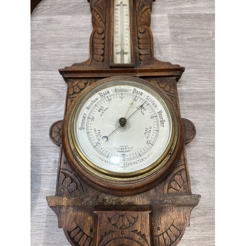Four early 20th century carved oak cased aneroid barometers - largest ...