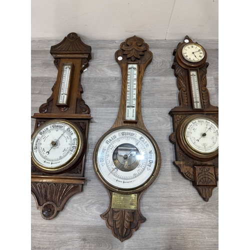 Four early 20th century carved oak cased aneroid barometers - largest ...