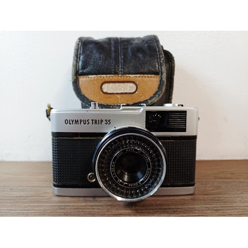 181 - A cased Olympus Trip 35 fully-automatic compact 35mm camera with wrist strap