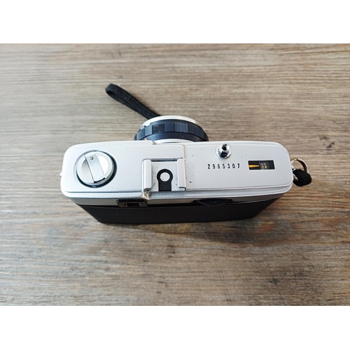 181 - A cased Olympus Trip 35 fully-automatic compact 35mm camera with wrist strap