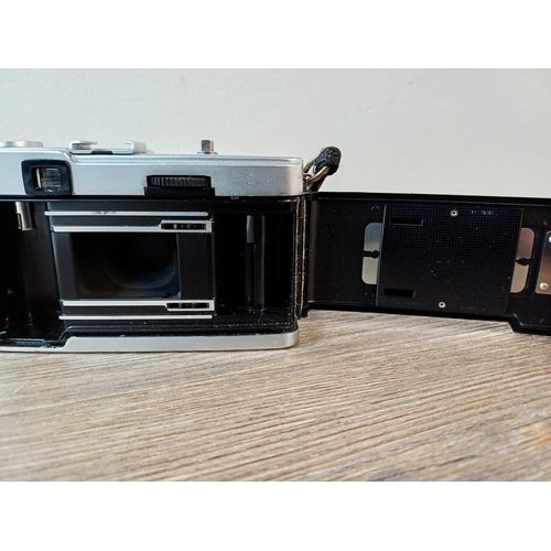 181 - A cased Olympus Trip 35 fully-automatic compact 35mm camera with wrist strap