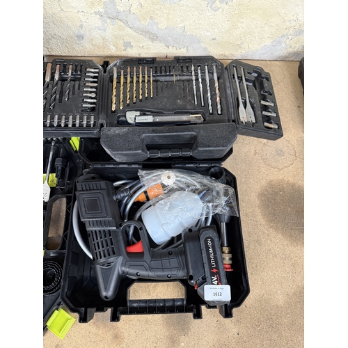 Four items, two drill bit sets, one cordless spray gun and one bag with ...