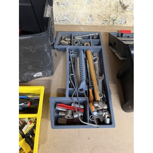 Two plastic tool boxes with contents to include hammers, screwdrivers ...