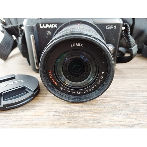 190 - Two cased Panasonic Lumix digital cameras with batteries, one DMC-GF1 Micro Four Thirds 12mp CMOS se... 