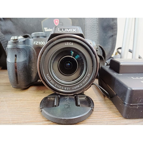 190 - Two cased Panasonic Lumix digital cameras with batteries, one DMC-GF1 Micro Four Thirds 12mp CMOS se... 