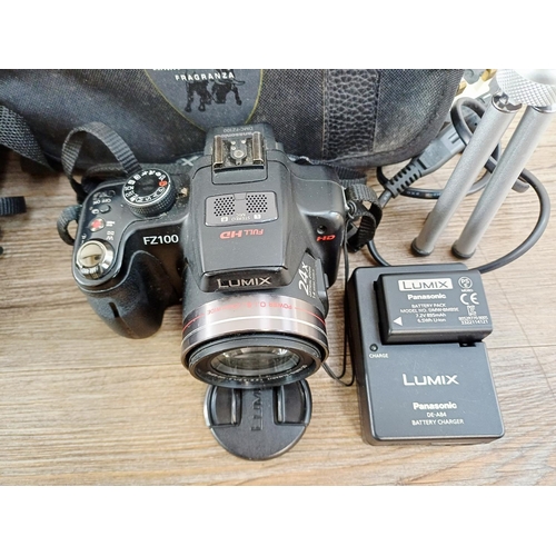 190 - Two cased Panasonic Lumix digital cameras with batteries, one DMC-GF1 Micro Four Thirds 12mp CMOS se... 