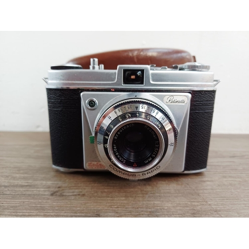 191 - Two 35mm cameras, one Olympus OM10 35mm SLR fitted with Zuiko MC Auto-S 1:1.8 50mm lens and one case... 