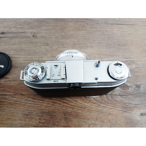 191 - Two 35mm cameras, one Olympus OM10 35mm SLR fitted with Zuiko MC Auto-S 1:1.8 50mm lens and one case... 