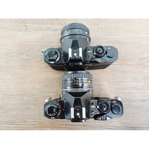 193 - Two black Pentax ME Super 35mm SLR cameras, one fitted with smc Pentax-M 1:1.7 50mm lens and one fit... 